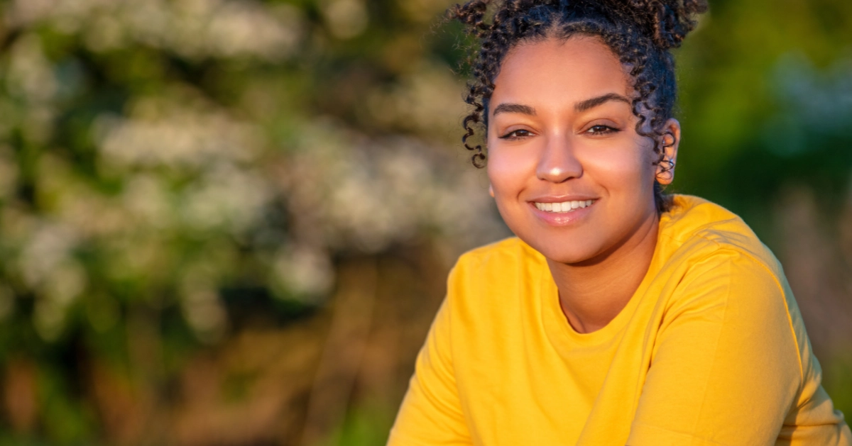 A teen girl posing for a picture