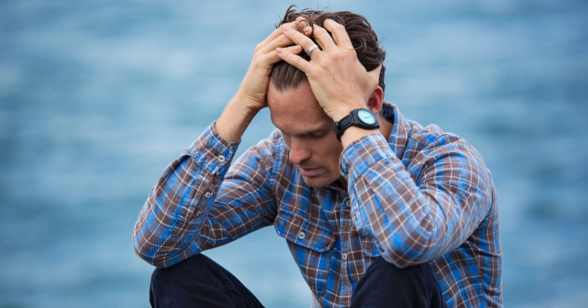 Man overwhelmed with sadness.