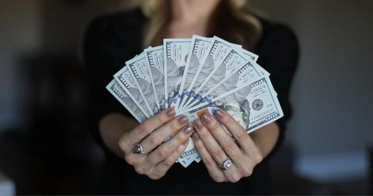A lady fanning money