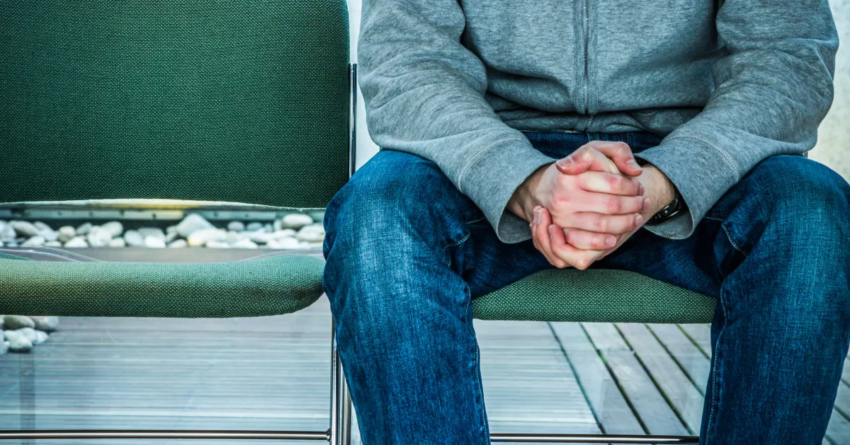 a guy sitting down with his
