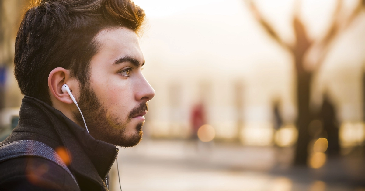 picture of a guy with earbuds in his ears