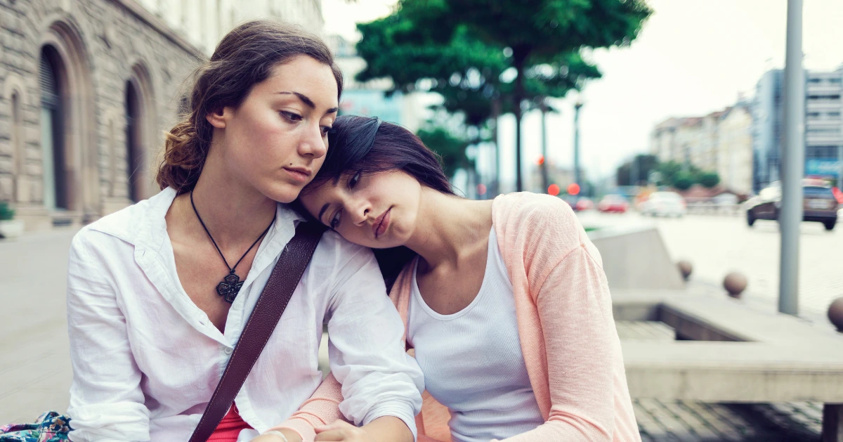 a friend comforting her friend