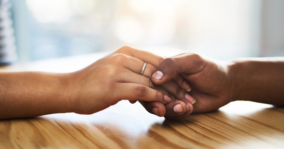 holding a loved one's hand