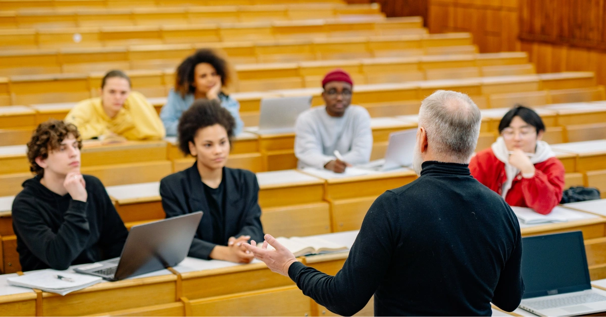 College students listening to a professor's lecture.