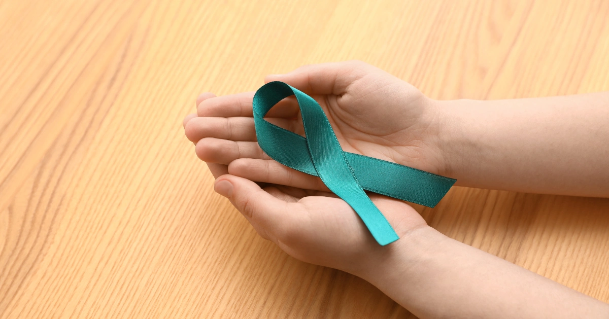 Hands holding PTSD Awareness Month Ribbon