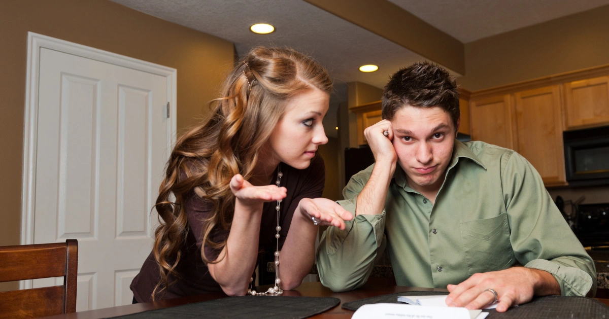 young couple stressed about paying their bills