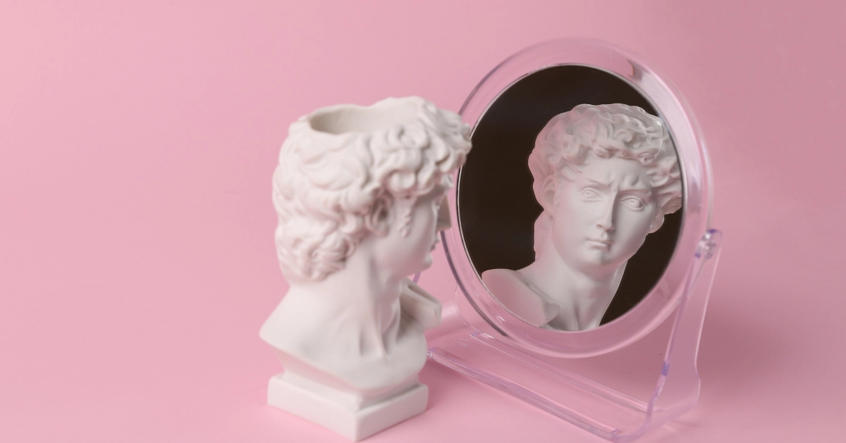 Bust of David admiring himself in a mirror. Narcissism.